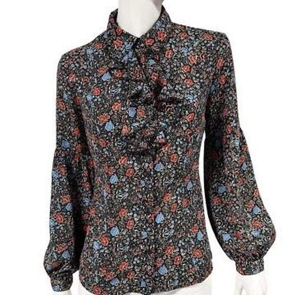 70s vibe Free People floral button up blouse has ruffle neckline, bishop sleeves